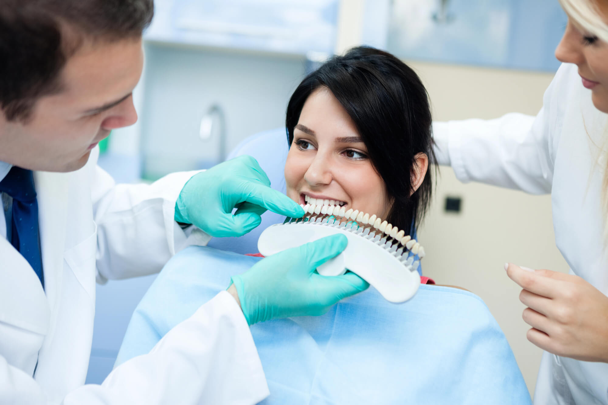 cosmetic dentist las vegas examines patient's teeth