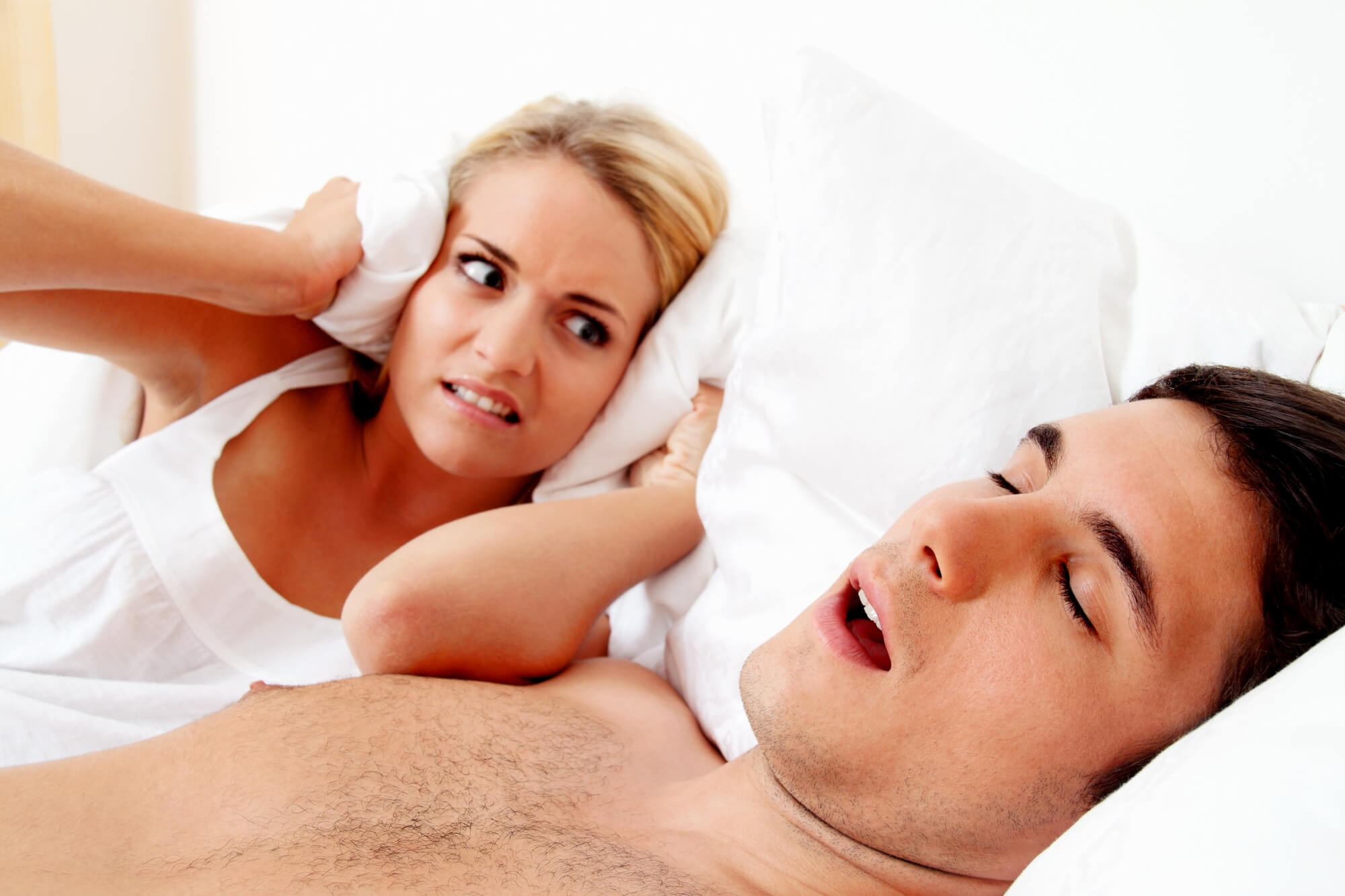 man snoring loudly needs to see a sleep apnea dentist las vegas 