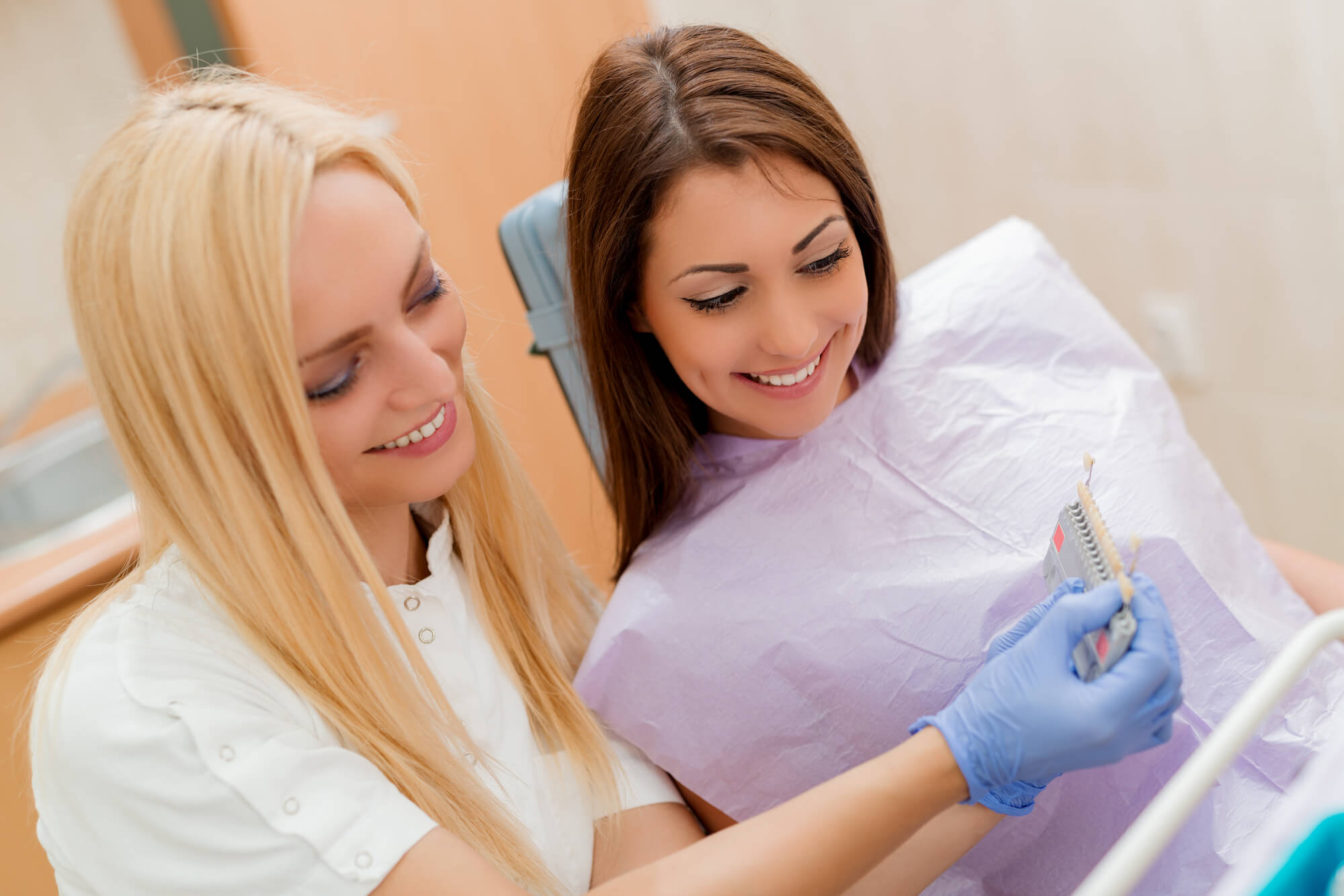 prosthodontist in las vegas lets patient choose a veneer shade
