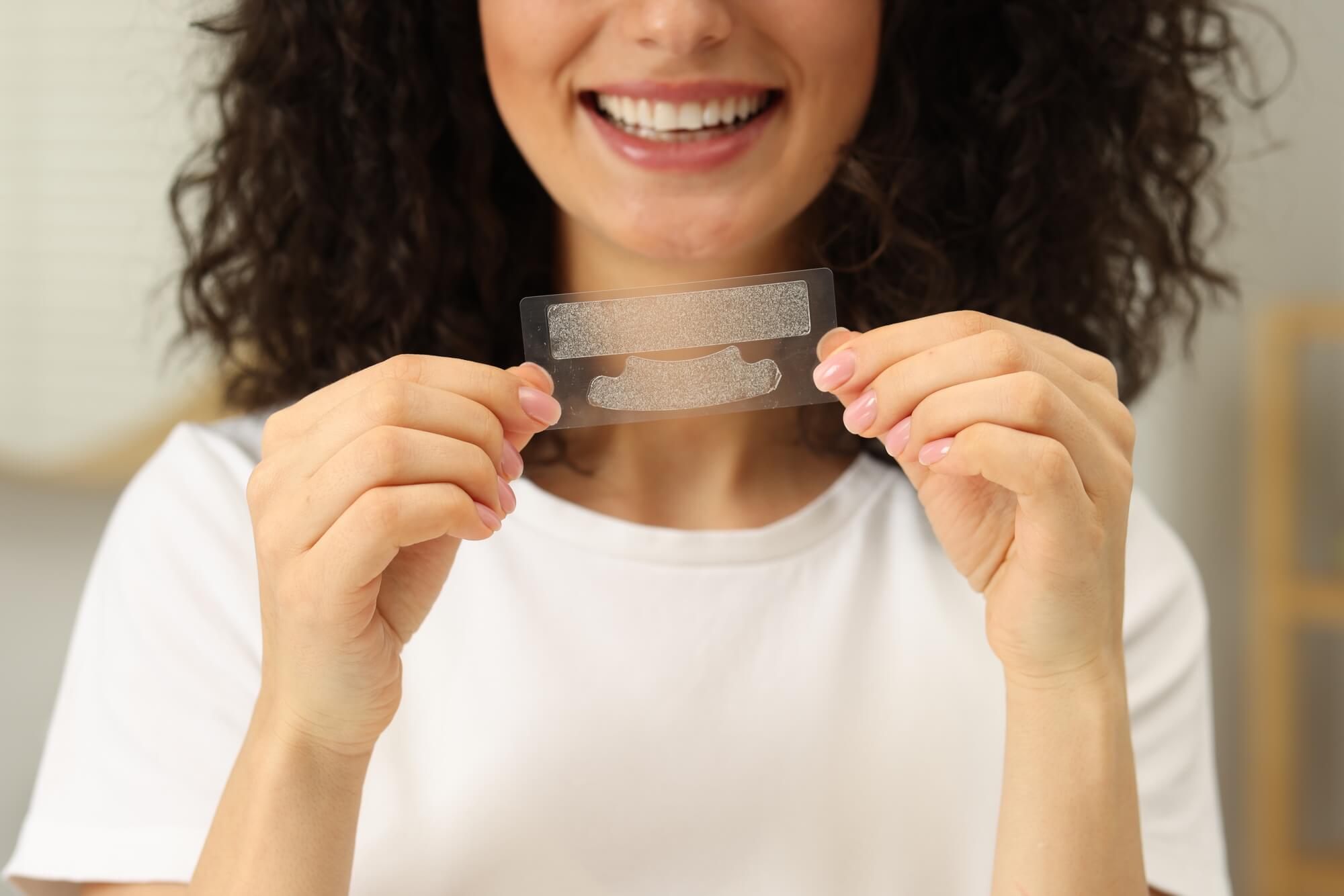 woman-using-strips-for-teeth-whitening-las-vegas-nv